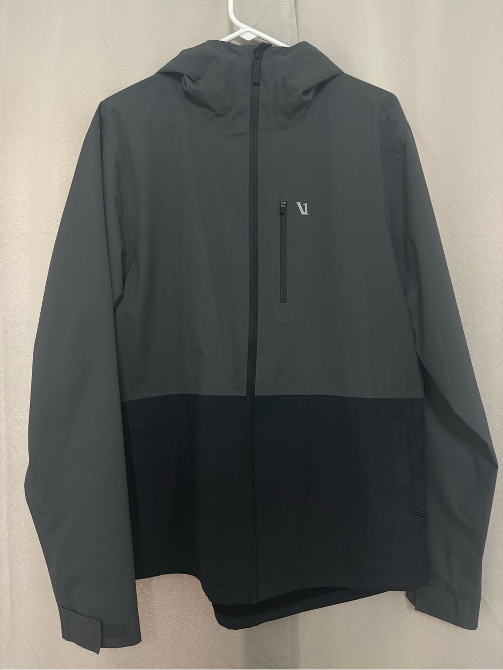 Vuori Oahu Rain Jacket. Two-Tone Hooded Rain Jacket in Dark Gray and Black